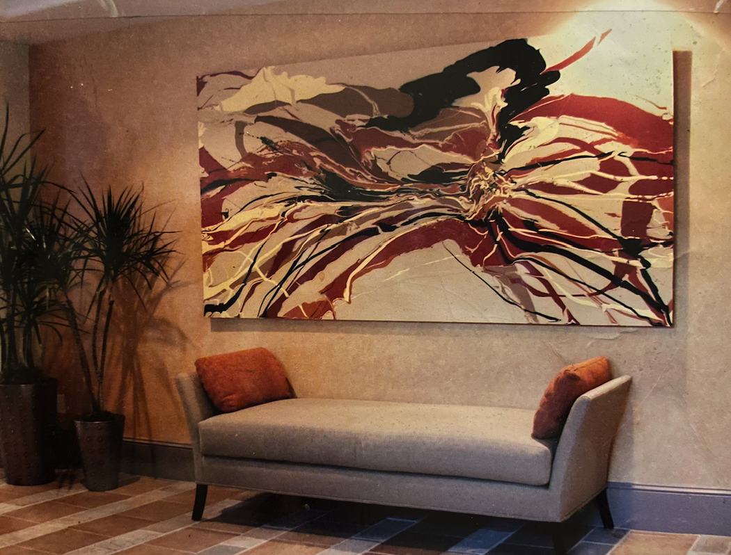 Large red and cream abstract above a daybed in a lounge